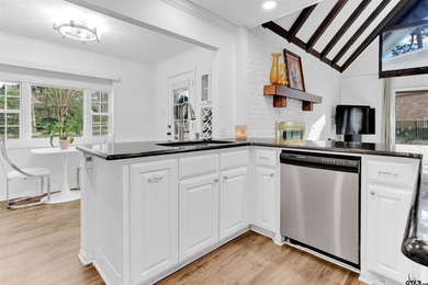 LOCATION, CHARM, AND FULL GUEST HOUSE. Nestled at the end of a