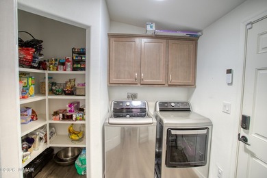Built in 2023, this well-maintained Cavco home is situated on a - photo 12