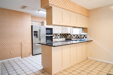 Lakefront classic! Brick ranch style home is ready for