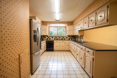 Lakefront classic! Brick ranch style home is ready for