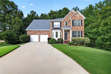 Tucked away on a private wooded homesite, this beautifully - photo 1