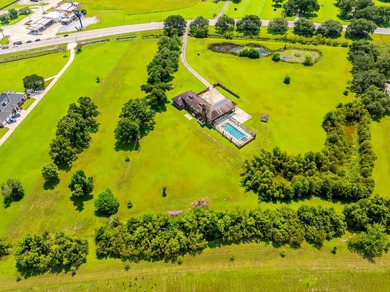 Welcome to a one-of-a-kind luxury estate on over 8 pristine