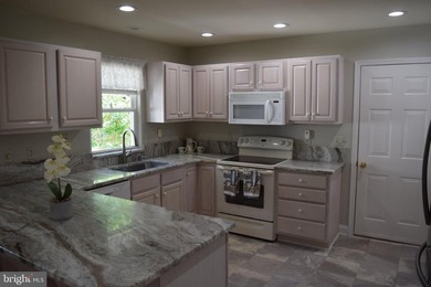 Nestled in the serene community of Captain's Cove, this is a - photo 9