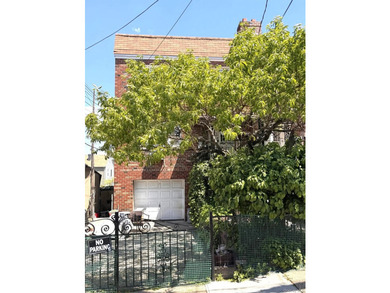 Beautifully updated two-family home in the Morris Park section - photo 1