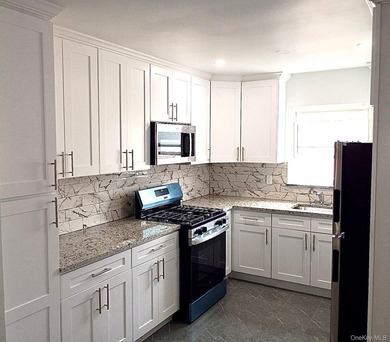 Beautifully updated two-family home in the Morris Park section - photo 9