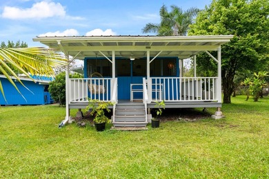 Tropical flexibility meets island charm on this fully fenced - photo 27