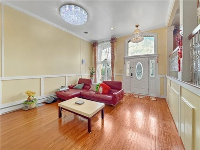Built in 2013, this detached two-family home with brick front - photo 7
