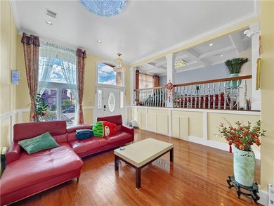 Built in 2013, this detached two-family home with brick front - photo 9