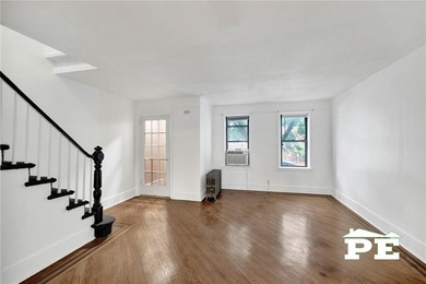 Welcome to 1392 Troy Avenue, a solid brick two-family home in - photo 3