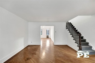Welcome to 1392 Troy Avenue, a solid brick two-family home in - photo 4