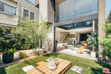 A refined coastal retreat awaits at this newly built modern - photo 1