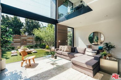 A refined coastal retreat awaits at this newly built modern - photo 2