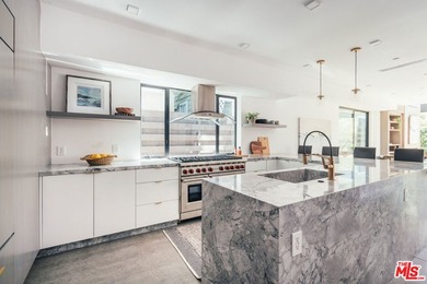 A refined coastal retreat awaits at this newly built modern - photo 7