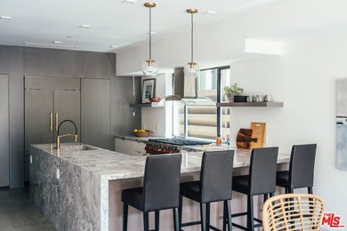 A refined coastal retreat awaits at this newly built modern - photo 8