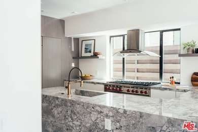 A refined coastal retreat awaits at this newly built modern - photo 9