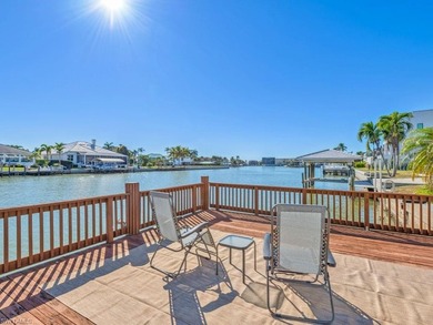 This home truly checks all the boxes! Set on a triple-wide canal - photo 2
