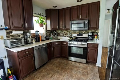 Welcome to this charming 4-bedroom, 2-full-bath Cape located in - photo 13