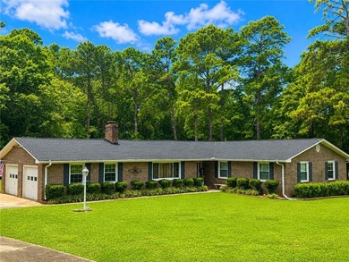 Welcome home to this beautifully maintained all-brick, 4-bedroom - photo 1