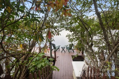 Situated on beautiful Lake Ticoa in the gated community of - photo 3