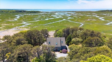 Set on 1.53 acres to the backdrop of marshlands, First Encounter