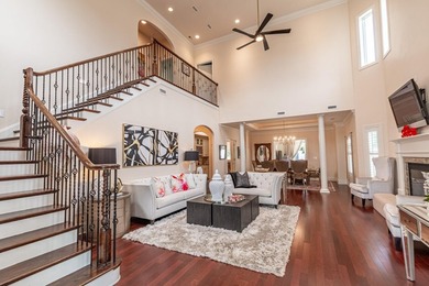 Located in the prestigious gated community of The Bluffs on the - photo 3