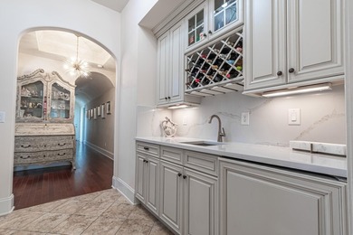 Located in the prestigious gated community of The Bluffs on the - photo 5
