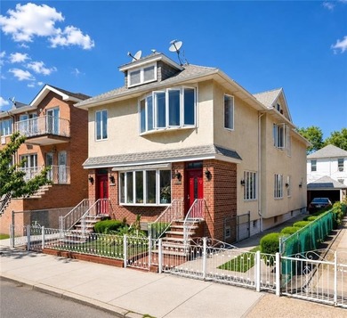 Detached multi-family home with a private driveway, offering the - photo 1