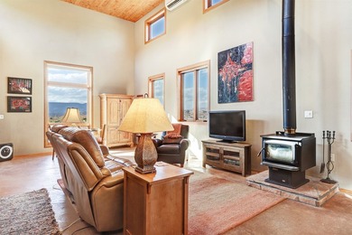 Come and enjoy the vistas of Abiquiu Lake and the red rocks of - photo 3
