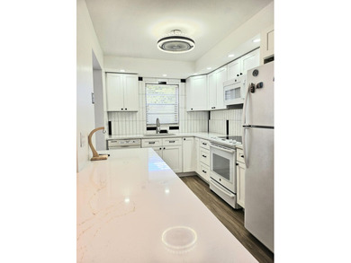 55+ golf course community. This light-filled home features a - photo 4