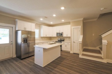 This Savannah floor plan features 3 bedrooms, 2.5 baths, and a - photo 3