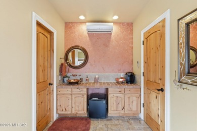 Tucked at the end of a winding private road, this desert