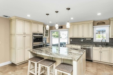 Expanded home featuring a gourmet eat-in kitchen with center - photo 7