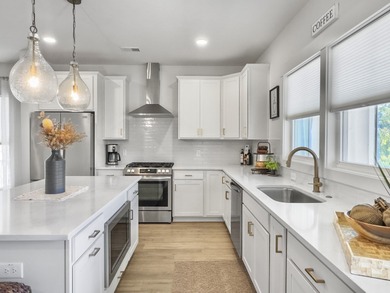 Welcome to 139 Sabal Court, a truly exceptional townhome in