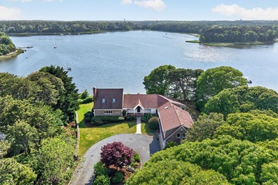 Set on a rare peninsula overlooking 27 acres of protected - photo 1