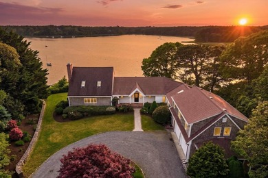Set on a rare peninsula overlooking 27 acres of protected - photo 3