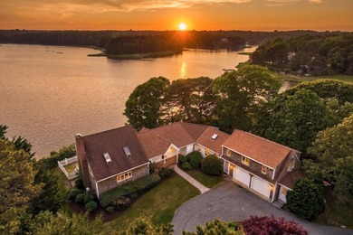 Set on a rare peninsula overlooking 27 acres of protected - photo 4