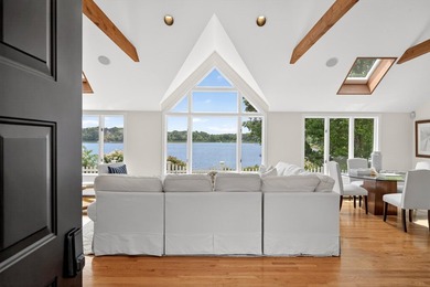 Set on a rare peninsula overlooking 27 acres of protected - photo 7