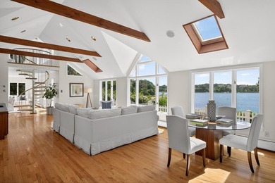 Set on a rare peninsula overlooking 27 acres of protected - photo 8