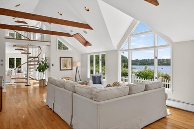 Set on a rare peninsula overlooking 27 acres of protected - photo 9