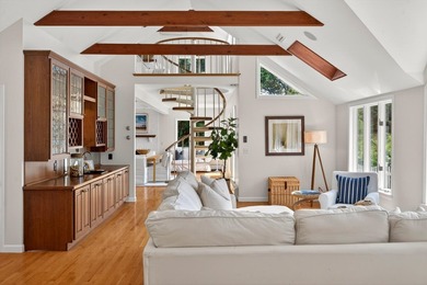 Set on a rare peninsula overlooking 27 acres of protected - photo 10