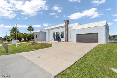 This stunning 3-bedroom, 3-bath contemporary Gulf access home
