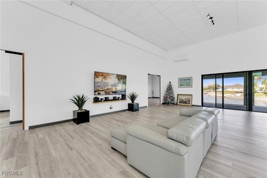 This stunning 3-bedroom, 3-bath contemporary Gulf access home