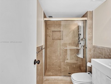 Oceanfront corner residence offering direct ocean views from the