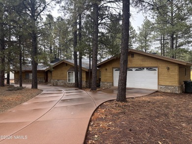 Fantastic golf course location home. Cedar siding and rock