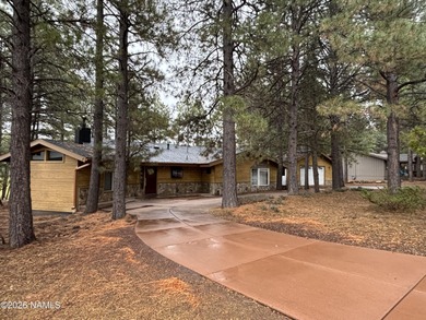 Fantastic golf course location home. Cedar siding and rock