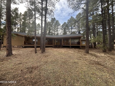 Fantastic golf course location home. Cedar siding and rock