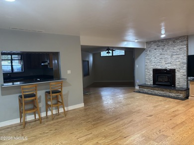 Fantastic golf course location home. Cedar siding and rock