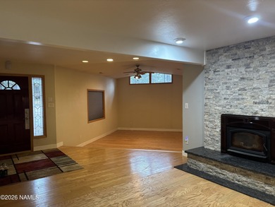 Fantastic golf course location home. Cedar siding and rock