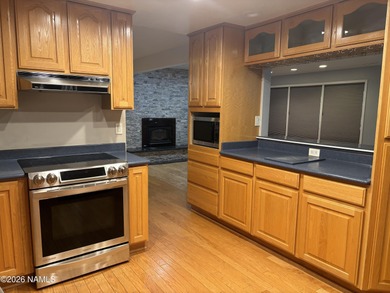 Fantastic golf course location home. Cedar siding and rock