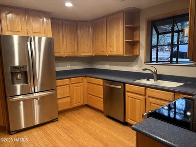 Fantastic golf course location home. Cedar siding and rock